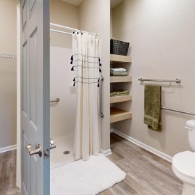Spacious bathrooms with everything you need a bathroom with a toilet and a shower unit
